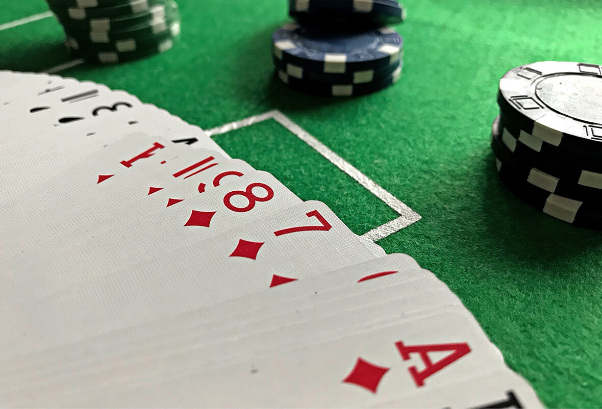 Cards and Chips on a green table close up